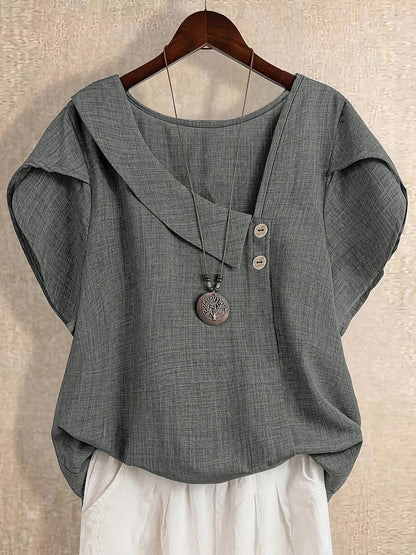 Dam Kortärmad Tunika Blus med Asymmetrisk Krage och Knappdetalj – Elegant och Avslappnad Stil