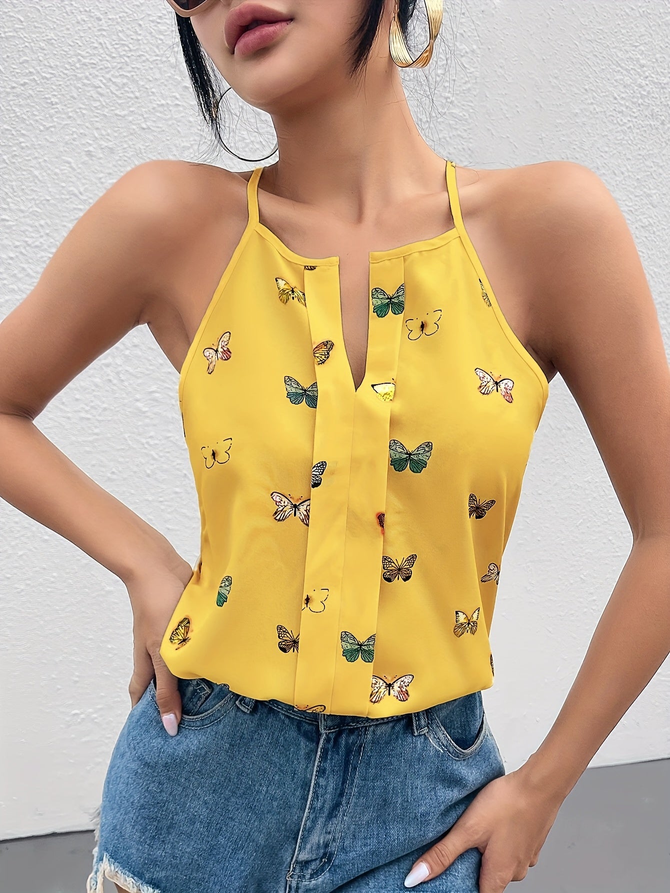 Damlinne med fjärilsmönster och halterneck – Elegant sommartopp