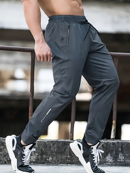 Herrarnas sportiga joggingbyxor för träning och fritid – avslappnad stil med dragkedjefickor