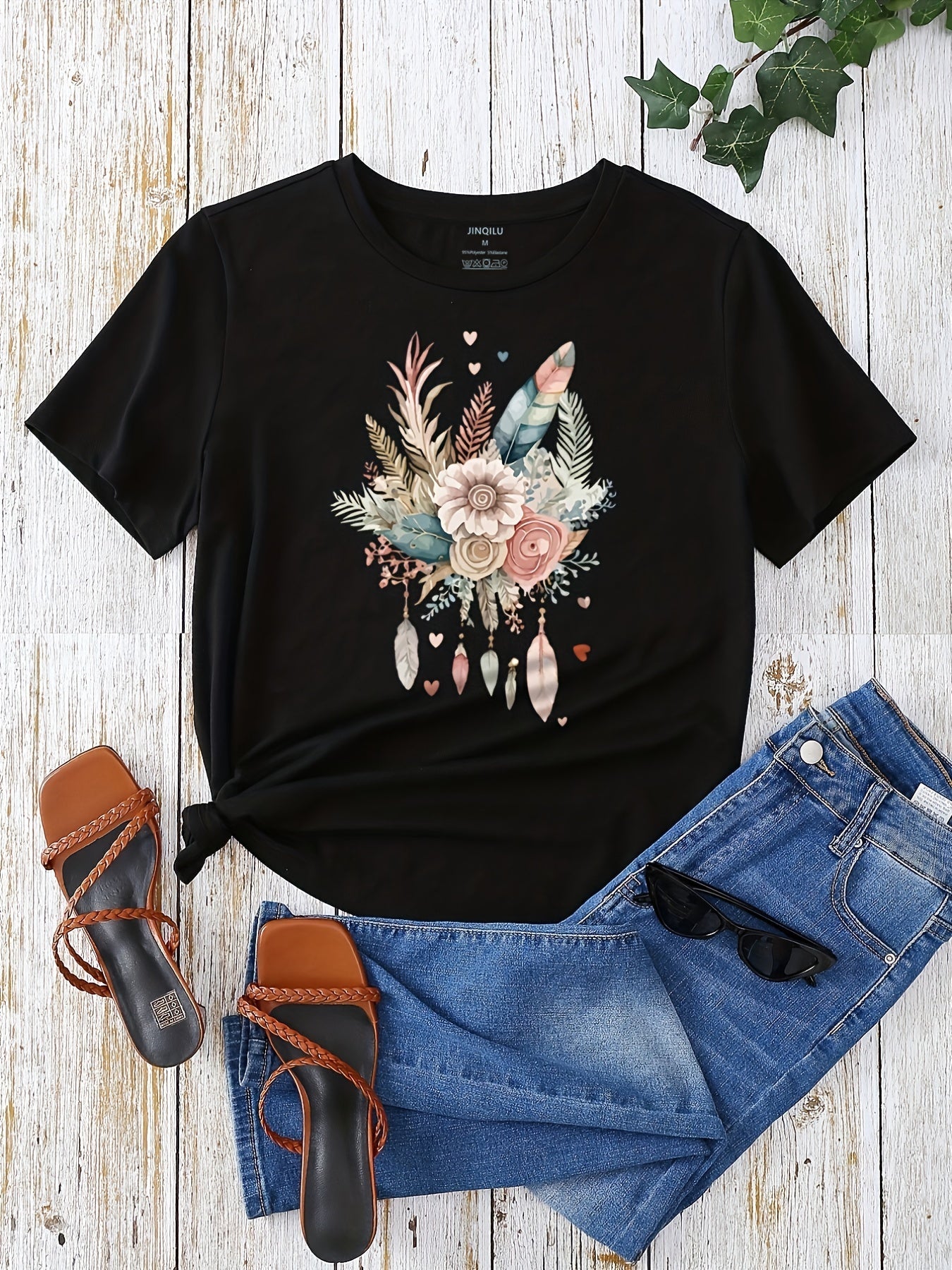 Dam T-shirt med blommigt och fjädertryck, avslappnad stil, perfekt för vardagsbruk