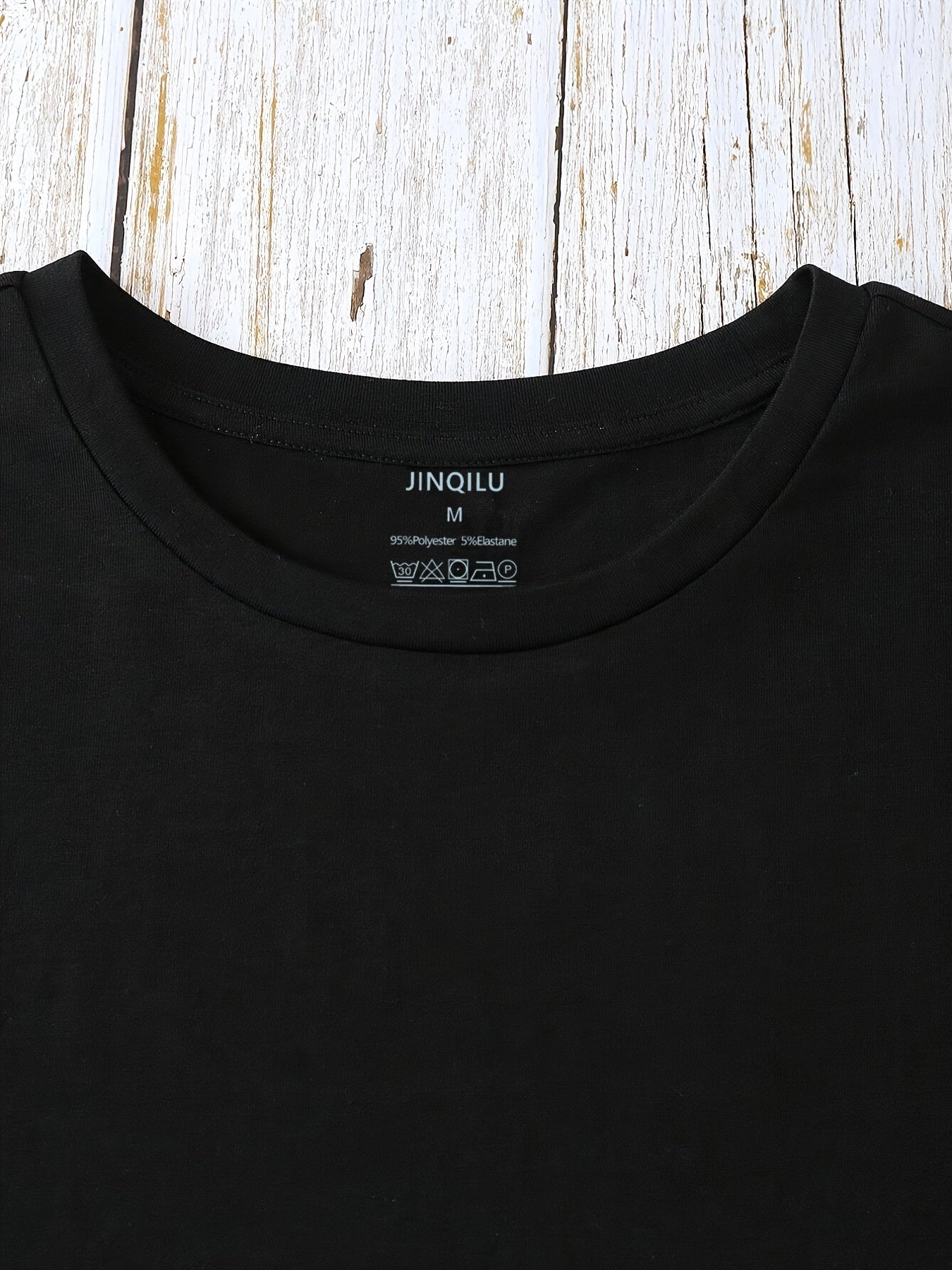 Dam T-shirt med blommigt och fjädertryck, avslappnad stil, perfekt för vardagsbruk