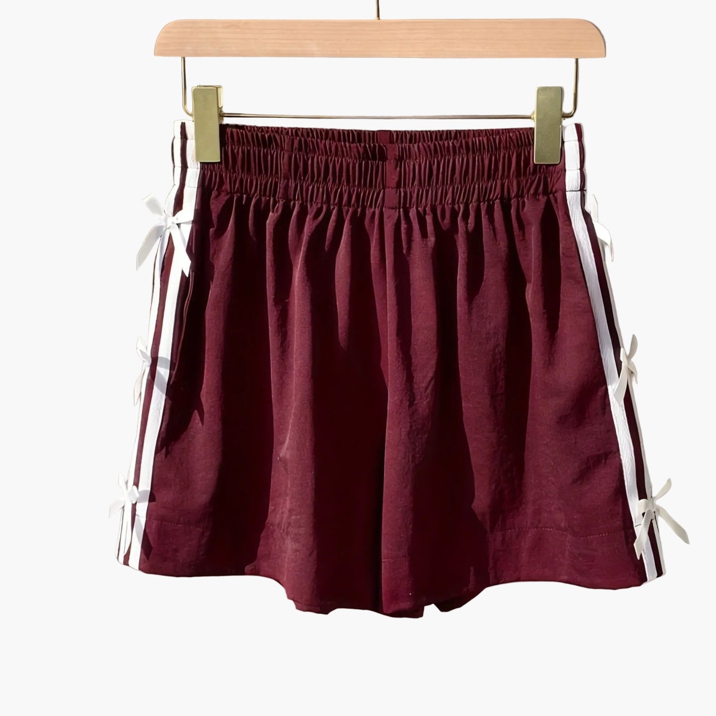 Damshorts med sportig design och dekorativa rosetter – Perfekt för sommar och semester